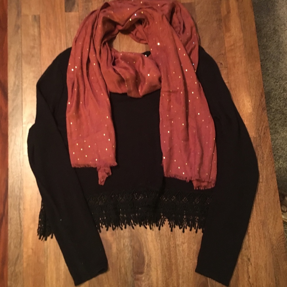 It’s a scarf! Beautiful burnt orange with gold!